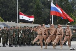 Репетиция российского парада в День Победы на авиабазе Хмеймим в Сирии. 4 мая 2016 года